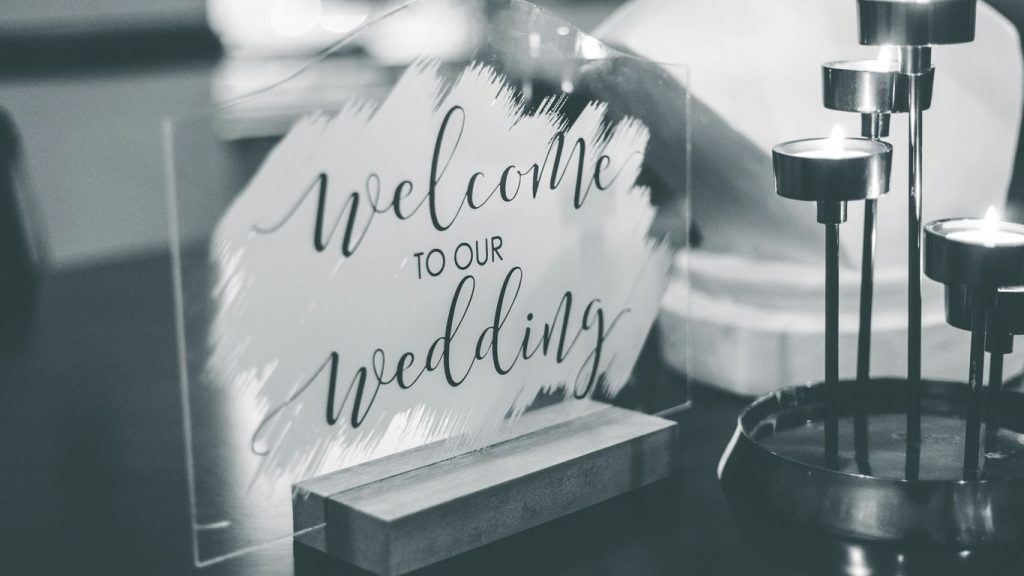 a black and white photo of a welcome sign