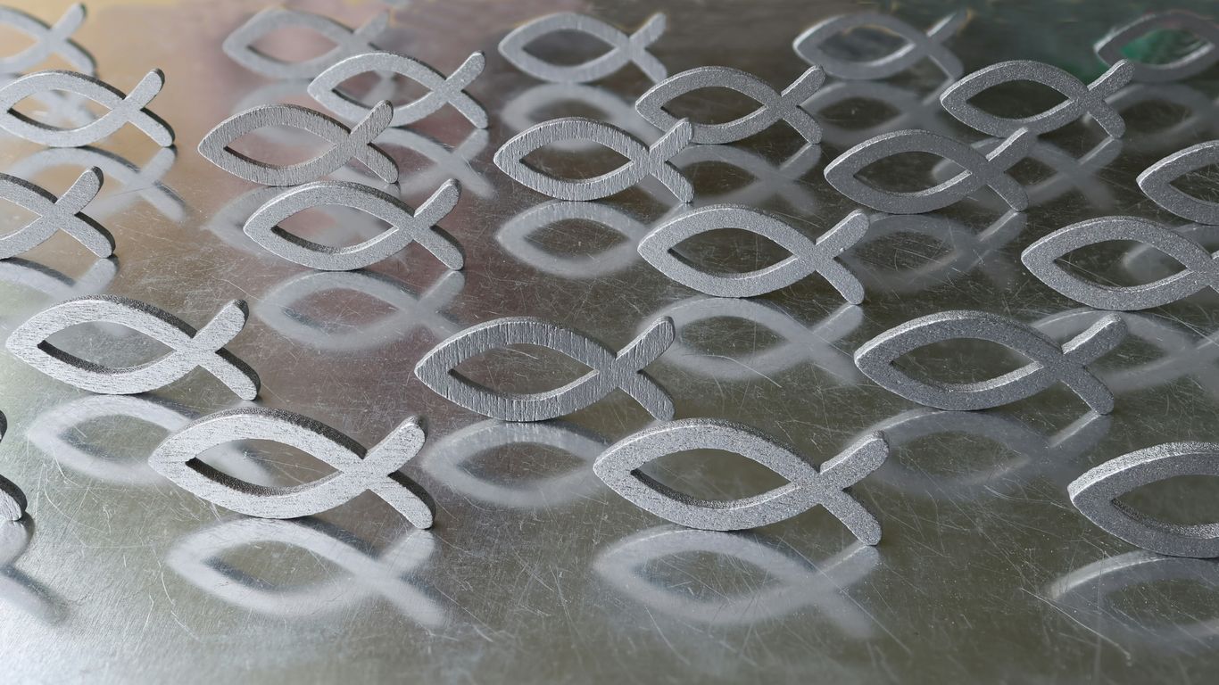 a close up of a metal surface with circles