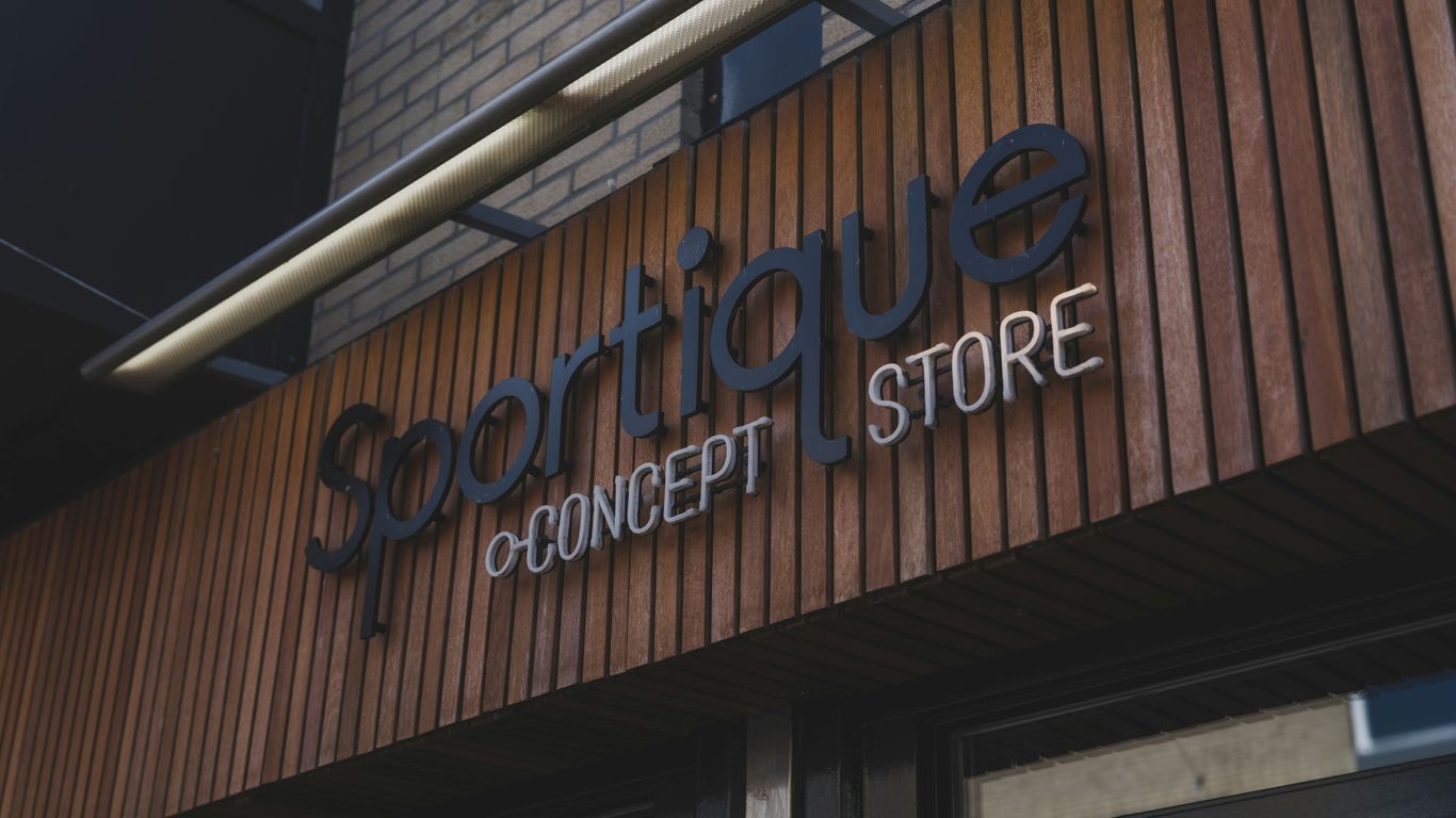 Sportique by concept store storefront sign