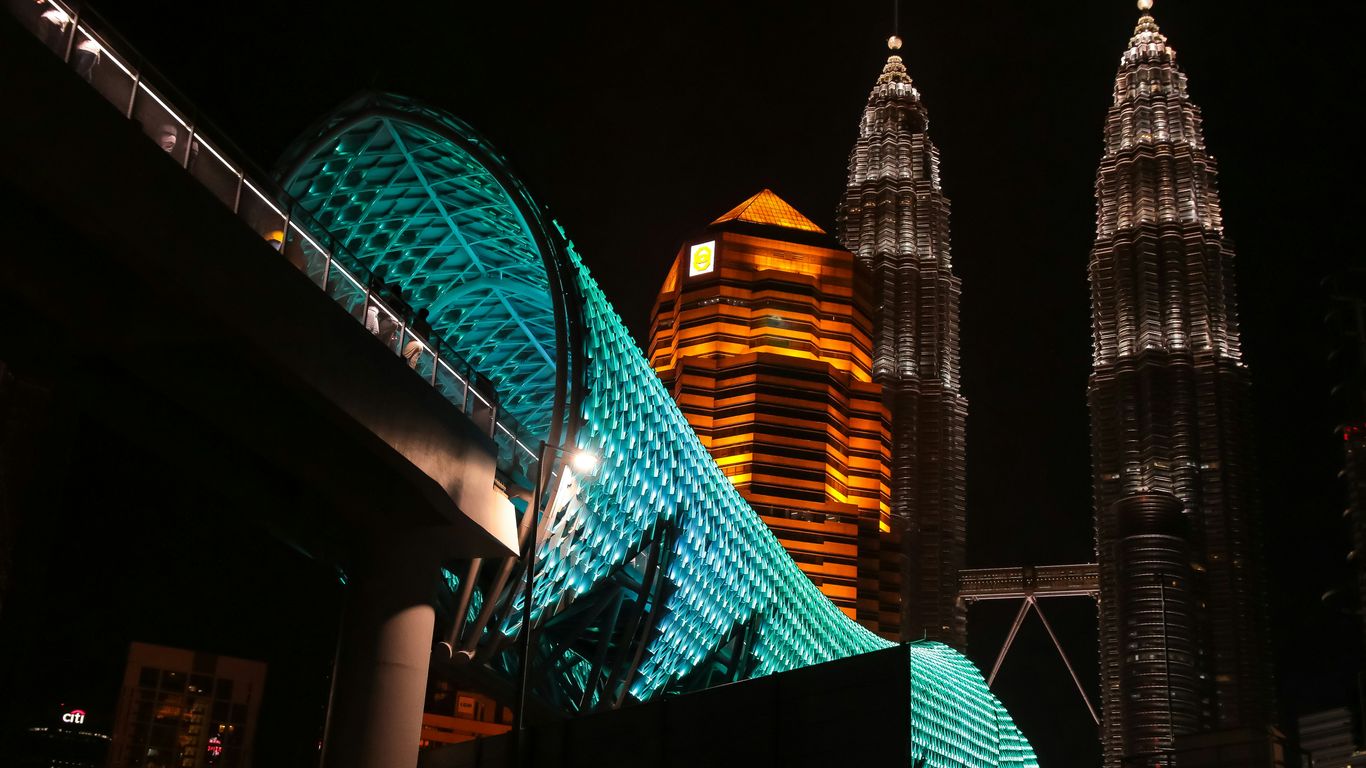 green and brown lighted building during night time