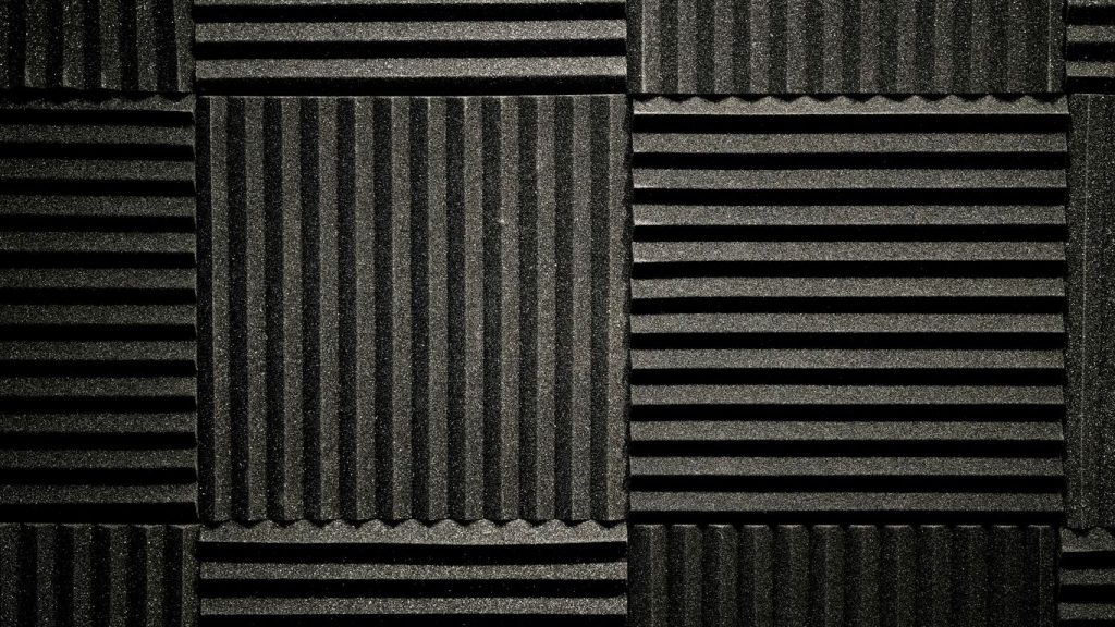 a black and white photo of a wall made of corrugated