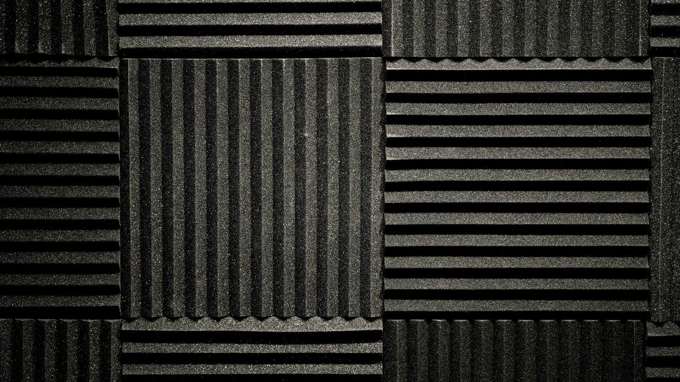 a black and white photo of a wall made of corrugated