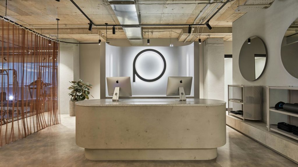Modern reception desk with minimalist decor and logo