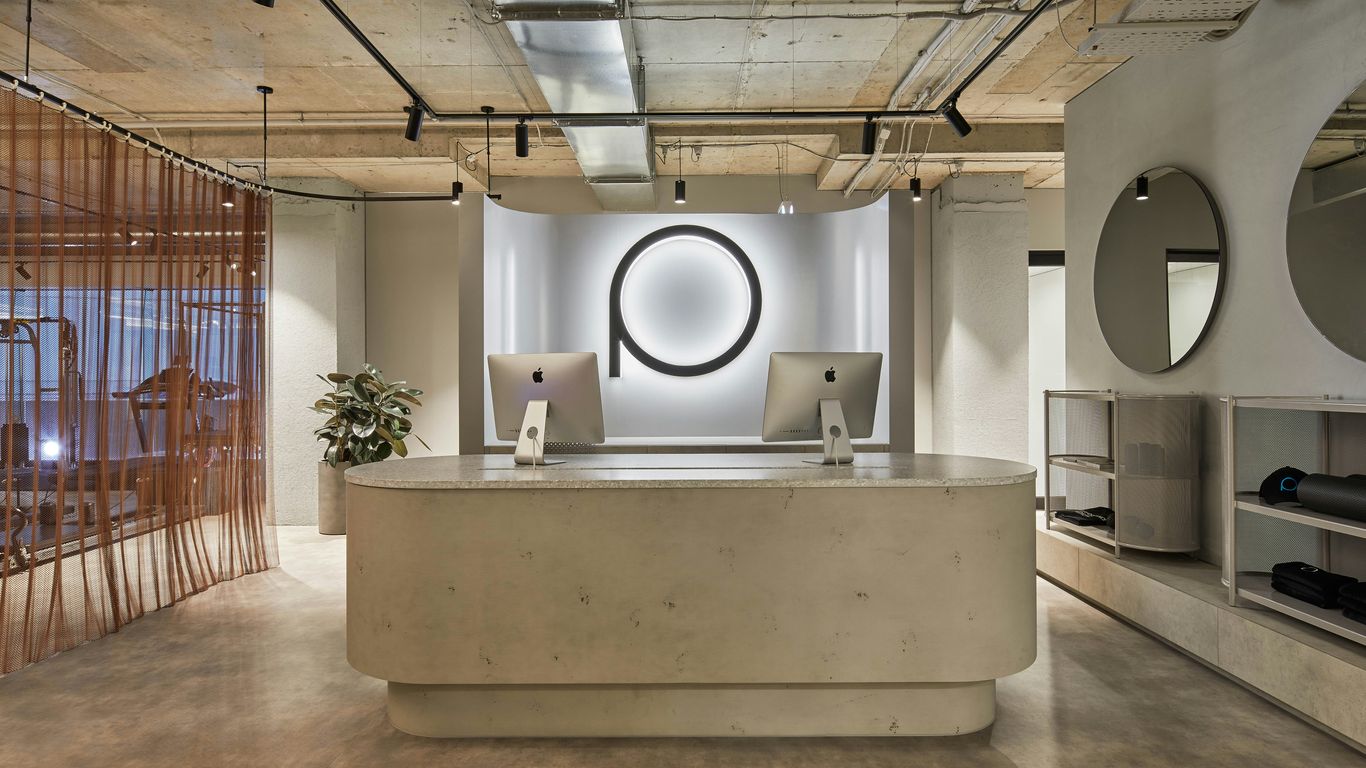 Modern reception desk with minimalist decor and logo