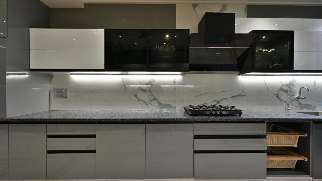a kitchen with a stove top oven next to a sink
