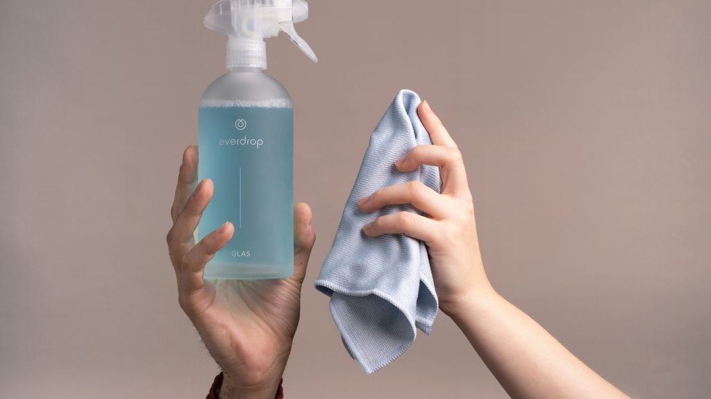 a person holding a bottle