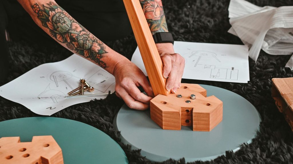 a person drawing on a piece of paper