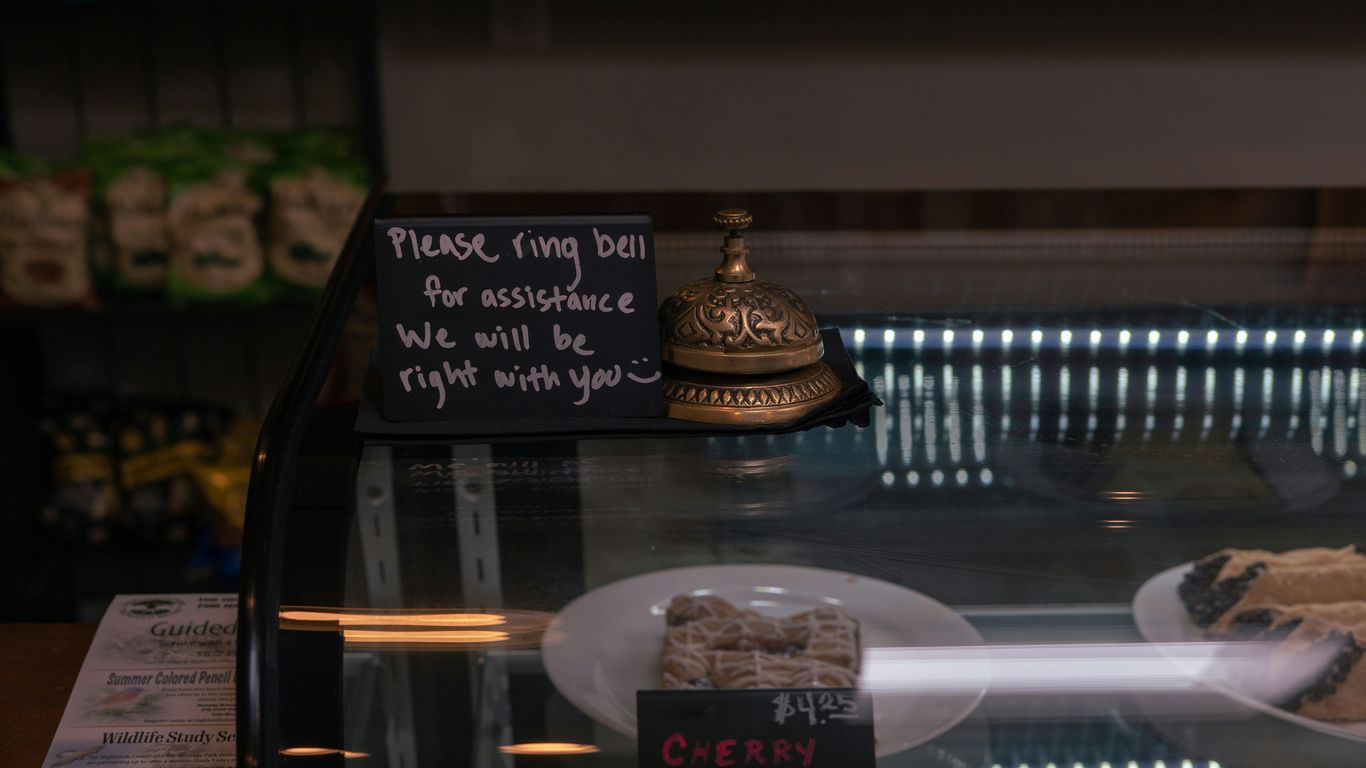 A bell and sign on a display case